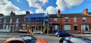 terraced house with scaffolding on the front - image 4