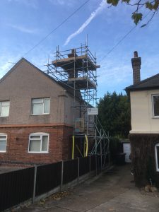 scaffolding on side of house for chimney work