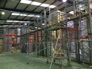 scaffolding inside of a warehouse - image 3