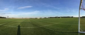 football field with small scaffolding tower on the left