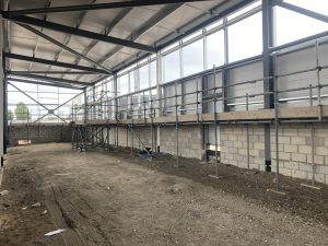 row of scaffolding inside of new ALDI store in lincoln for construction of interior walls - image 1