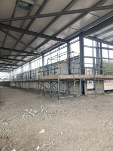 row of scaffolding inside of new ALDI store in lincoln for construction of interior walls - image 2