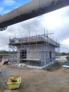 scaffolding surrounding a room under construction at a sugar factory in Newark