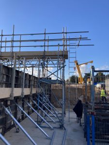 a small amount of scaffolding and other safety equipment on a construction site