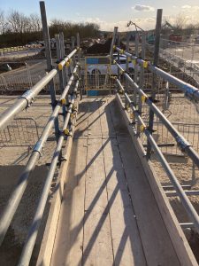 a small amount of scaffolding on a construction site